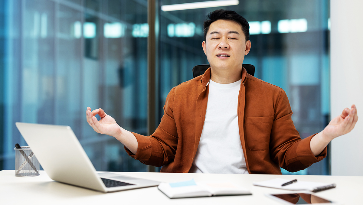 Man meditating at office